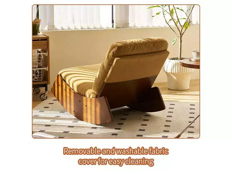 Poltrona a dondolo Glider con struttura in legno e rivestimento in velluto a coste