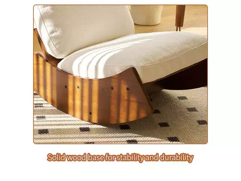 Poltrona a dondolo Glider con struttura in legno e rivestimento in velluto a coste